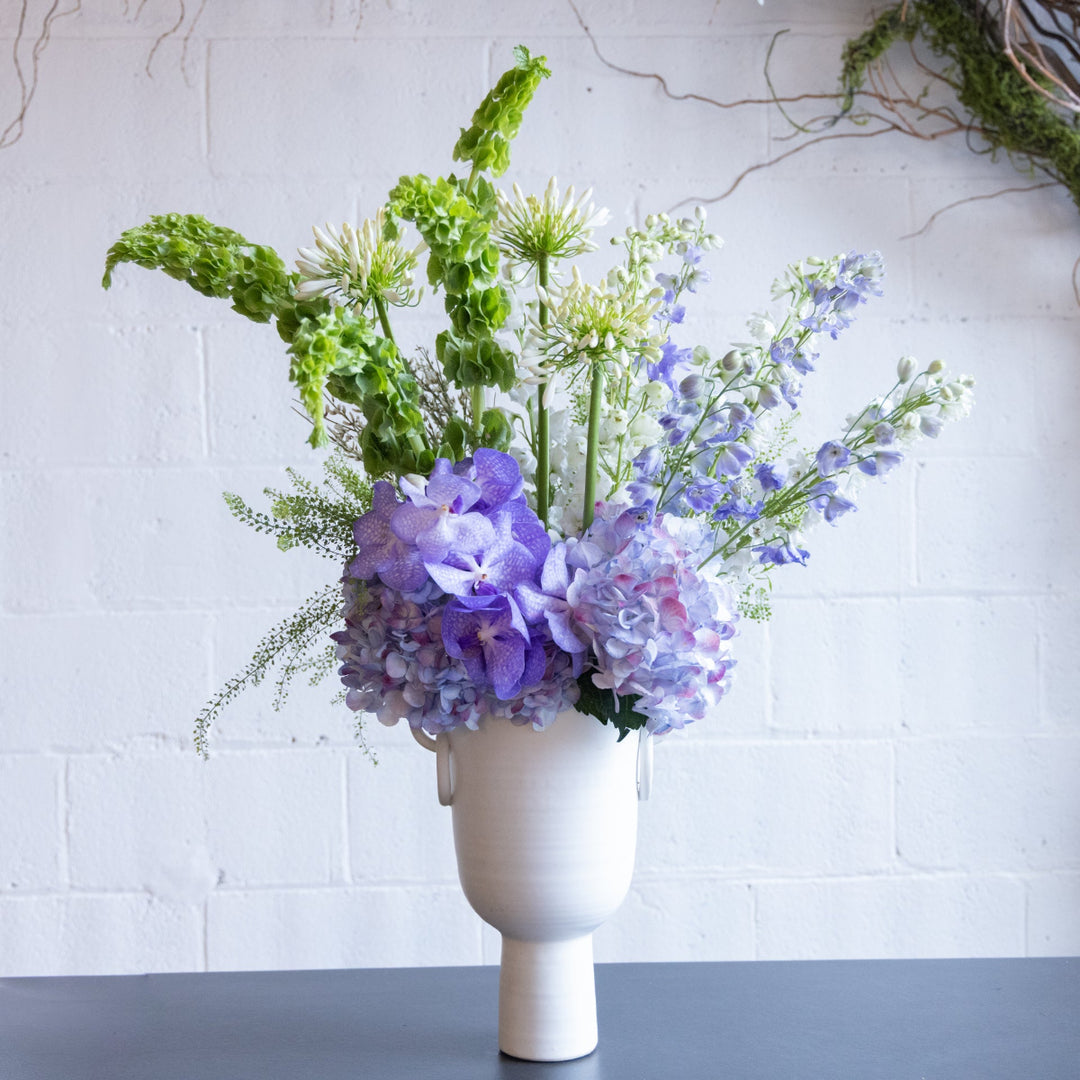 Floral arrangement in a white vase 
