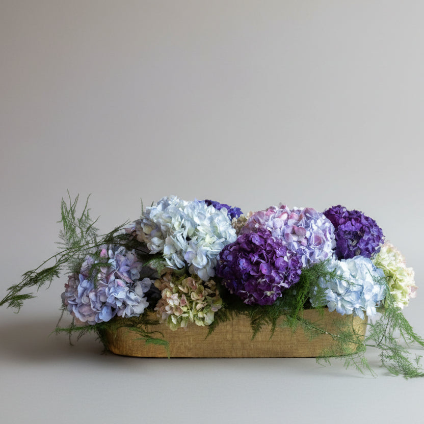 Floral arrangement with purple and white hydrangeas 