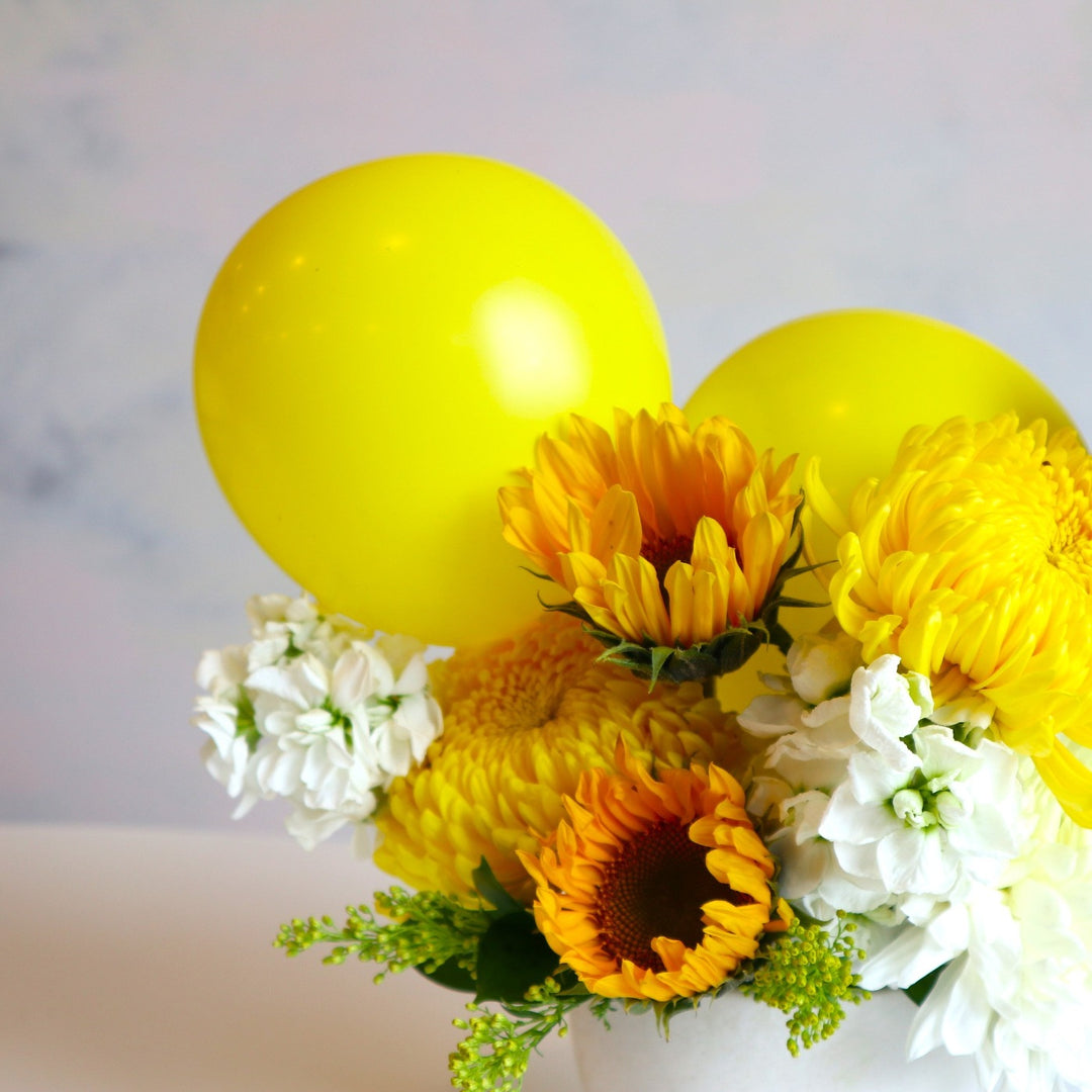 sunflowers, mums, stock with yellow balloons