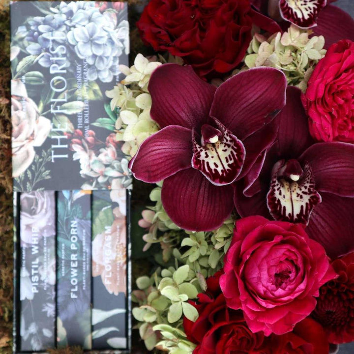 Giftbox with The Florist perfume set with florals, orchids, garden roses, hydrangea and dahlias close up.