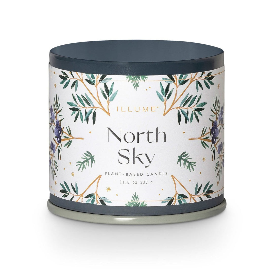 Illume North Sky Candle | A blue tin with a white label that has illustrations of leaves and berries. Text reads "Illume, North Sky, plant-based candle, 11.8 oz, 335 g."