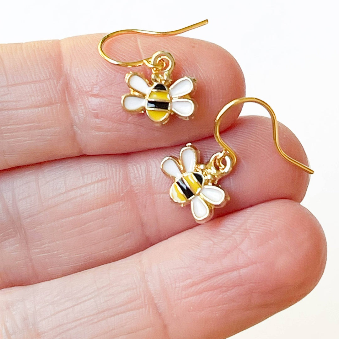 Nest Pretty Things | Tiny Honey Bee Earrings | Place in a model's hand for scale reference.