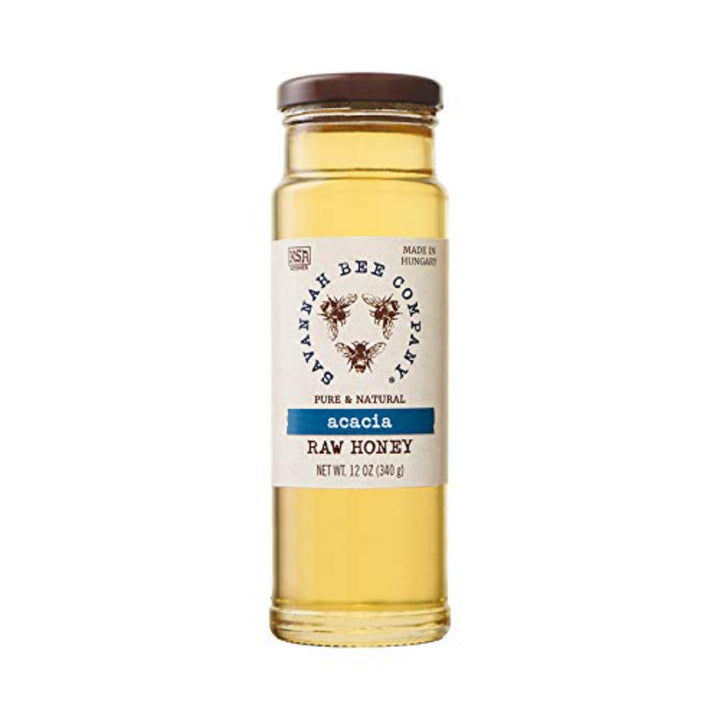 Savannah Bee Company Acacia Raw Honey, 12oz jar. Clear jar with blue and cream packaging.