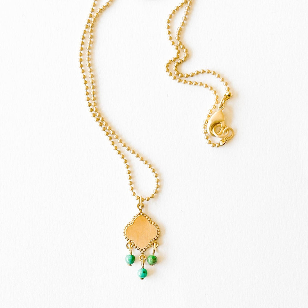 Nest Pretty Things | Turquoise Pendant Necklace | A gold pendant with dangling turquoise beads.