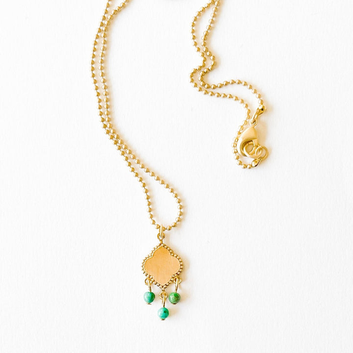 Nest Pretty Things | Turquoise Pendant Necklace | A gold pendant with dangling turquoise beads.