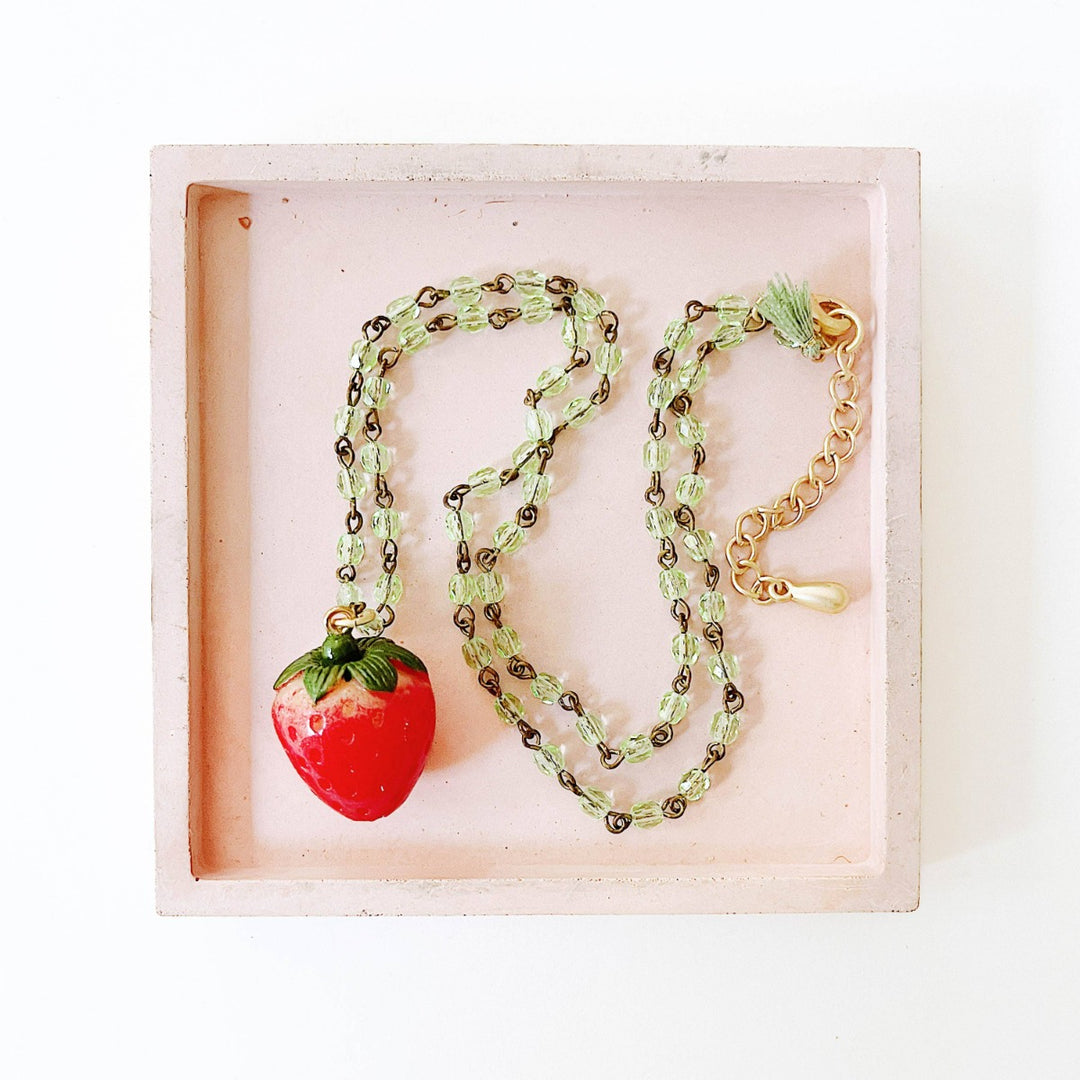 Nest Pretty Things | Kids Strawberry Charm Necklace | A strawberry necklace with a green beaded chain.