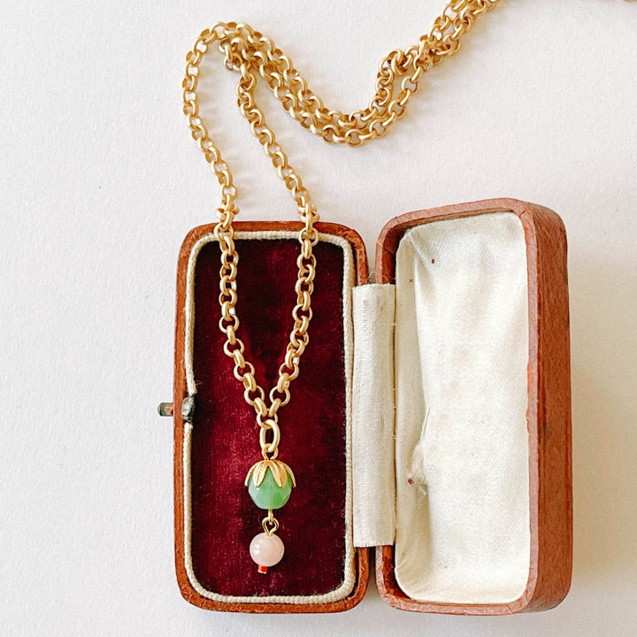 Nest Pretty Things | Thick Gold Rose Quartz necklace | A gold chain with a green bead and a pink bead pendant.