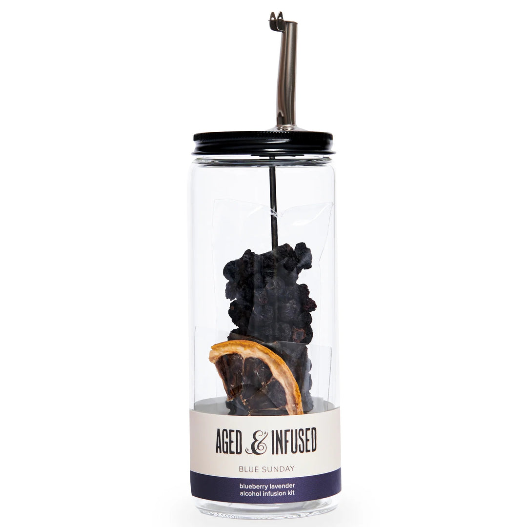 piced orange, Alcohol infusion kit. Clear jar with dehydrated blueberries, and a orange visible through the glass. Black lid with pouring spout.