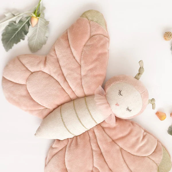 Butterfly Stuffed Toy | A soft pink butterfly toy against a background of white with natural accents.