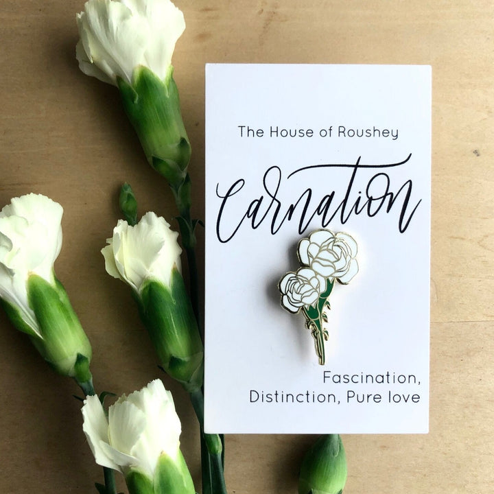 Enamel Pins by Christy Roushey | The House of Roushey, Canations pin. The bottom of the packaging reads "Fascination, Disctinction, Pure love".