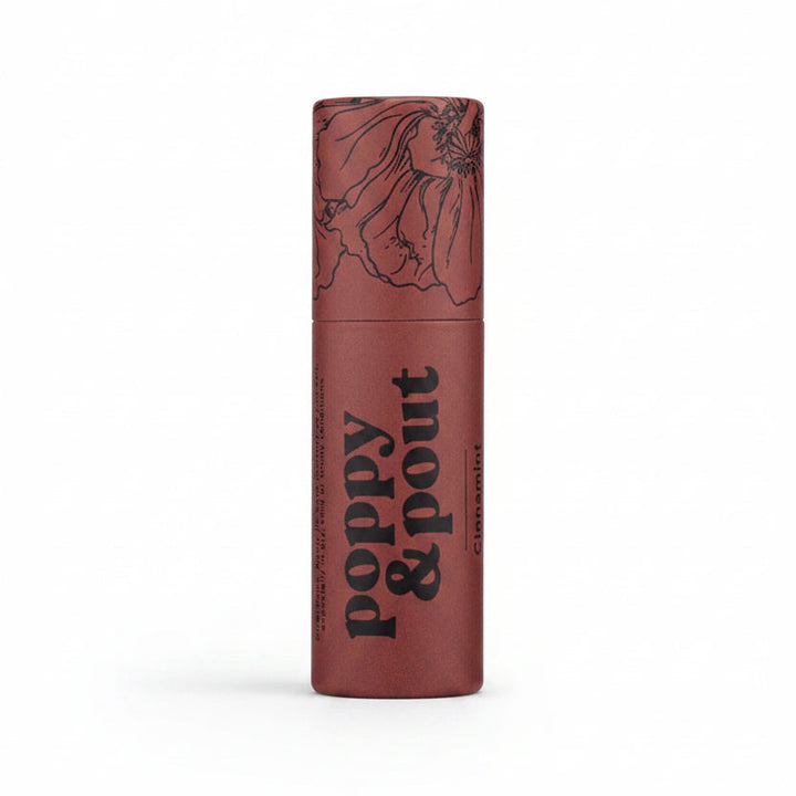 Poppy &amp; Pout Lip Balm | A red lip balm stick with trendy black line illustration and text that reads "Poppy &amp; Pout Cinnamint".