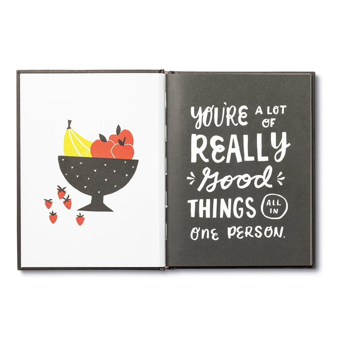 You're A Good Human - Inside spread, left page is a bowl with bananas, apples, and strawberries. Right page as black with white text "You're a lot of really good things all in one person.".