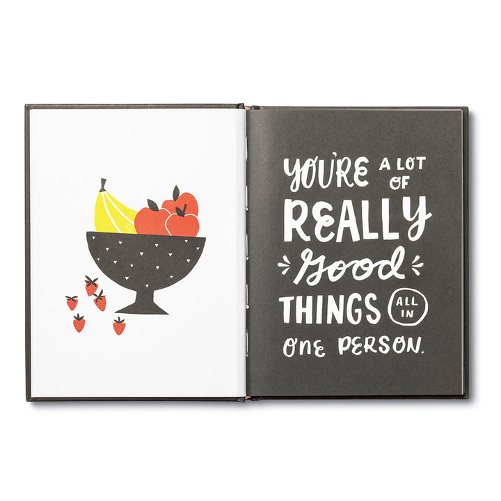 You're A Good Human - Inside spread, left page is a bowl with bananas, apples, and strawberries. Right page as black with white text "You're a lot of really good things all in one person.".