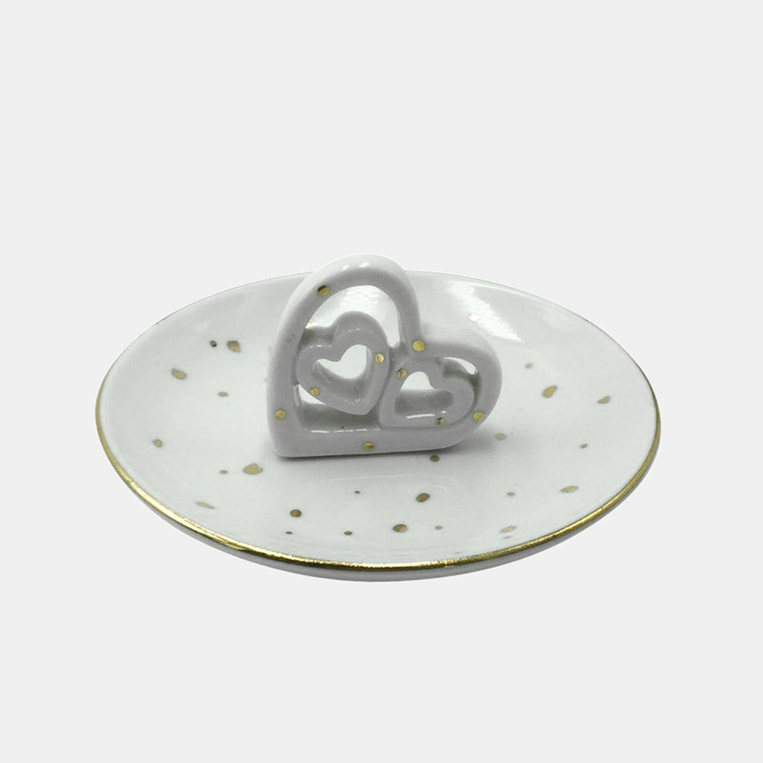 Cut-Out Hearts Tray | A ceramic tray with gold speckled and a gold lined rim. 