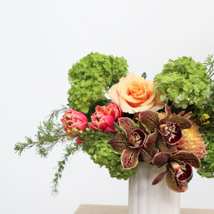 Delightful | Close up shot of the double tulips, rose, orchids, and hydrangea.