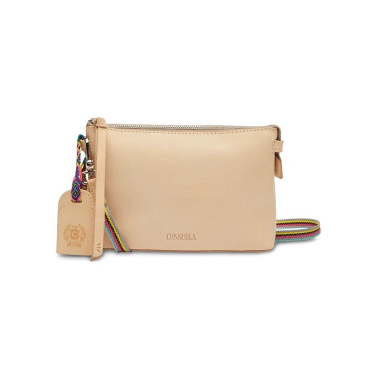 Diego Midtown Crossbody | Consuela | A Diego leather crossbody bag with matching Diego leather accents and colorful friendship bracelet. Pink sparkly interior.