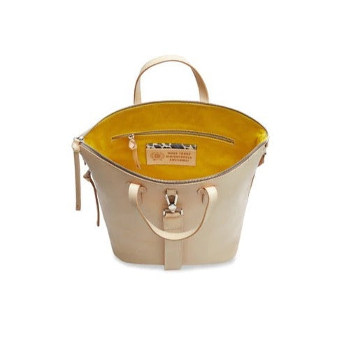 Diego Sling | Consuela | A Diego leather exterior with a yellow interior that has the Consuela motto "Make Today Ridiculously Awesome!".