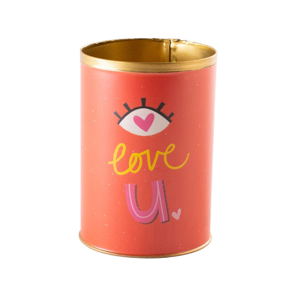 "Eye" Love You Can. A red can with an eye, Love written in yellow. and a "U" in pink. Photo taken on a white background.