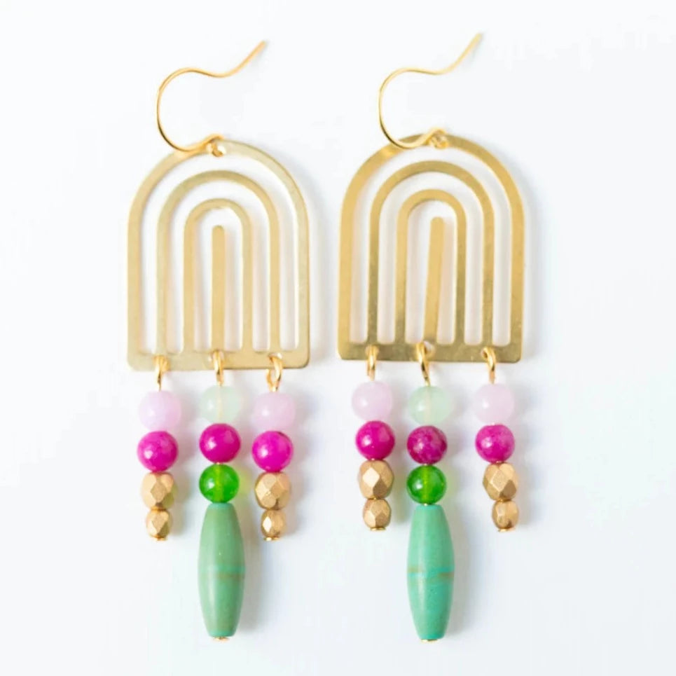 Fancy Turquoise Chandeliers | Nest Pretty Things | Gold rainbow arch earrings with three dangling strands of beads. The beads are jewel toned pinks, gold, and turquoise.