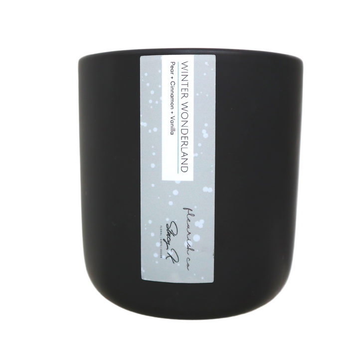 Fleurish Co. Flower City Candle | Winter Wonderland, pear, cinnamon, vanilla. Black ceramic candle with light blue/gray label. Stacy K floral and fleurish co. exclusive scent!