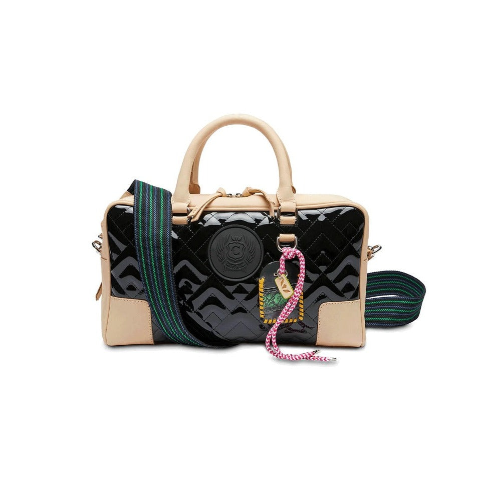 Inked Satchel | Consuela | A glossy black bag with Diego leather accents, leather ID card pocket, and a blue/green/black crossbody strap.