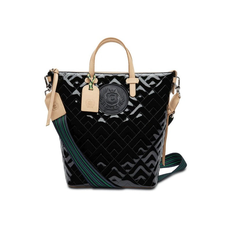Inked Sling | Consuela | A glossy bag with the Consuela quilted pattern, nude accents/handle, and a green/blue crossbody strap.