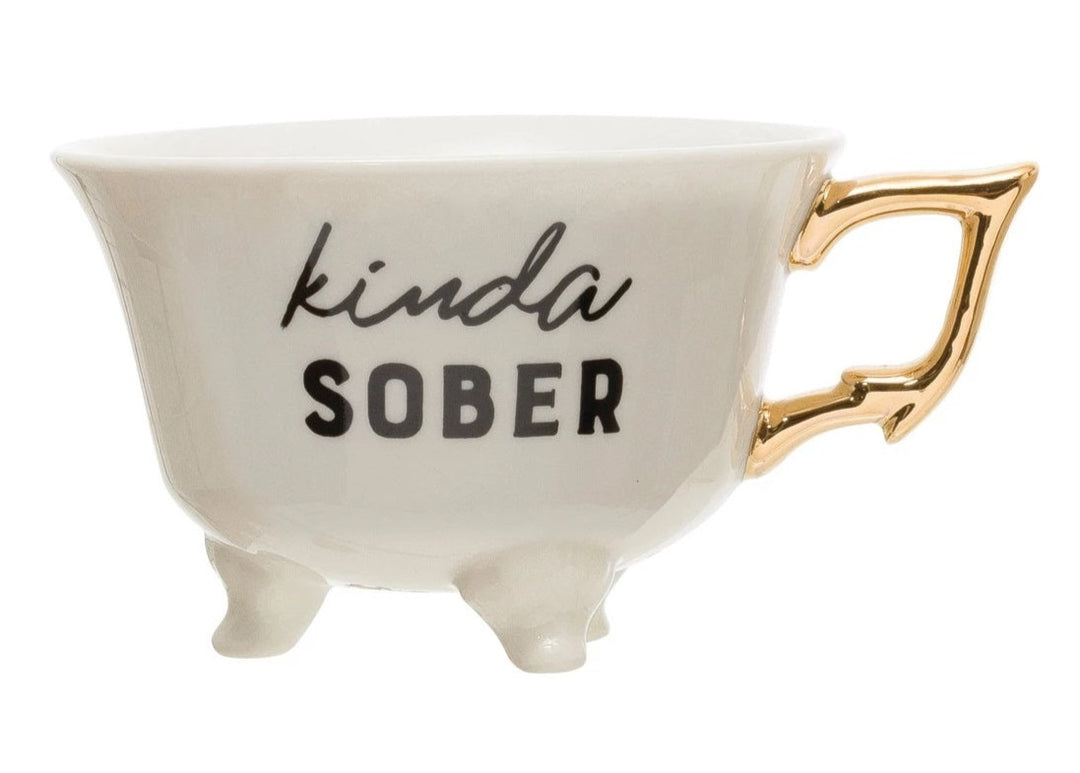 Saying Teacups | White Teacup with little feet and a gold handle. Reads "Kinda Sober".