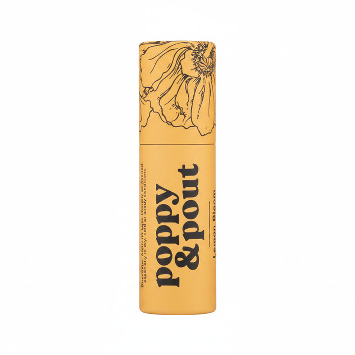 Poppy and Pout Lip Balm | A yellow lip balm stick with trendy black line illustration and text that reads "Poppy &amp; Pout Lemon Bloom".