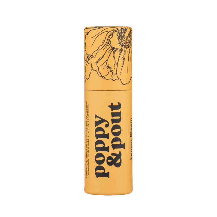 Poppy and Pout Lip Balm | A yellow lip balm stick with trendy black line illustration and text that reads "Poppy & Pout Lemon Bloom".