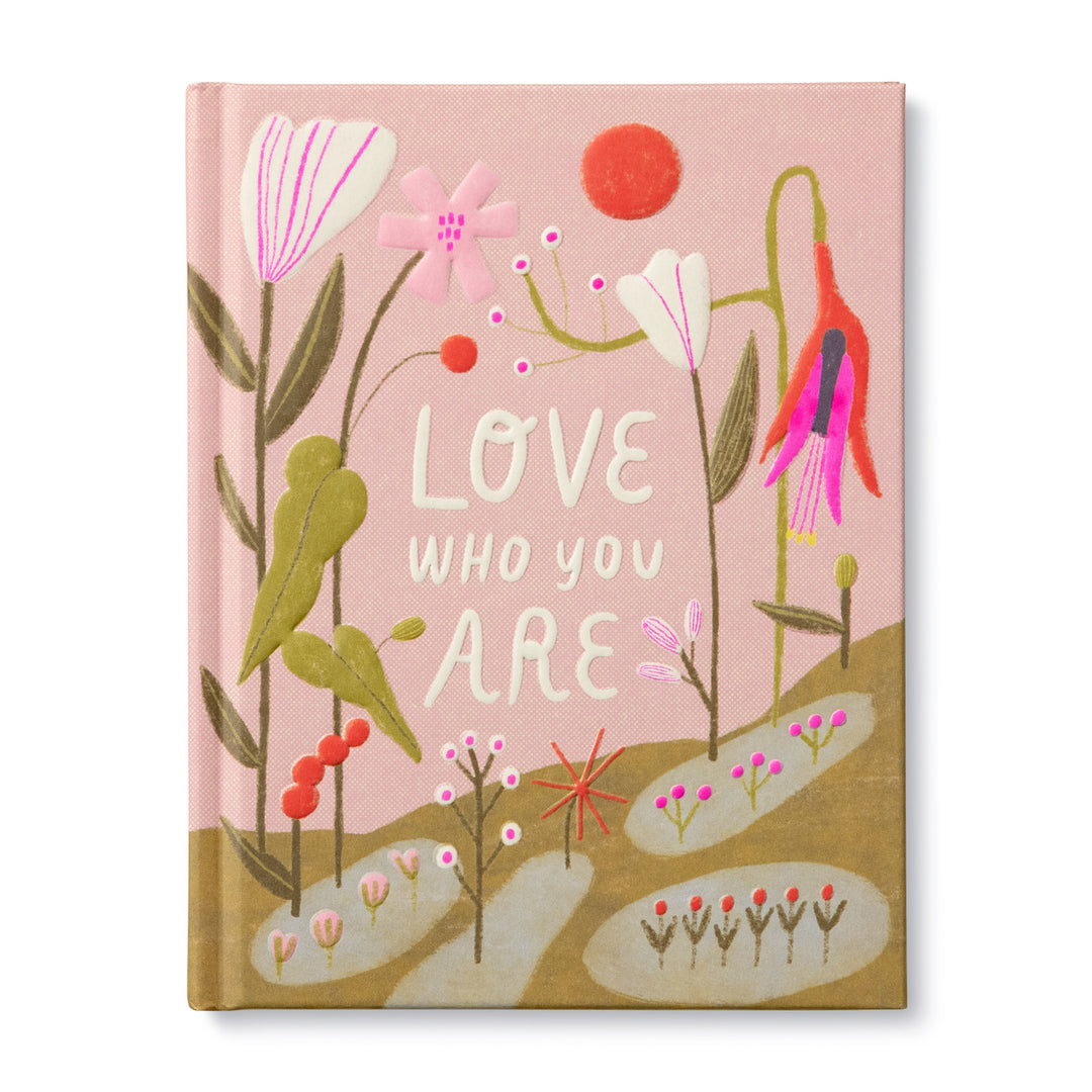 Love Who You Are | A pink book cover with green, red, white, pink, and purple floral pattern.