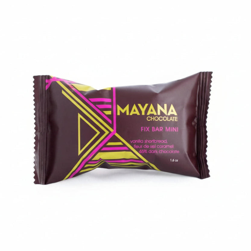 Mayana Mini Fix Bar Mini - vanilla shortbread, fleur de sel caramel, 66% dark chocolate, 1.5oz. Brown package with gold and pink geometric pattern.
