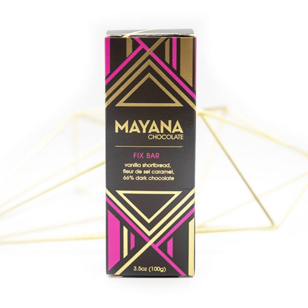 Mayana Chocolate Fix Bar, Vanilla shortbread, fleur de sel caramel, 66% dark chocolate. Brown box with geometric gold and pink accents. 3.5oz