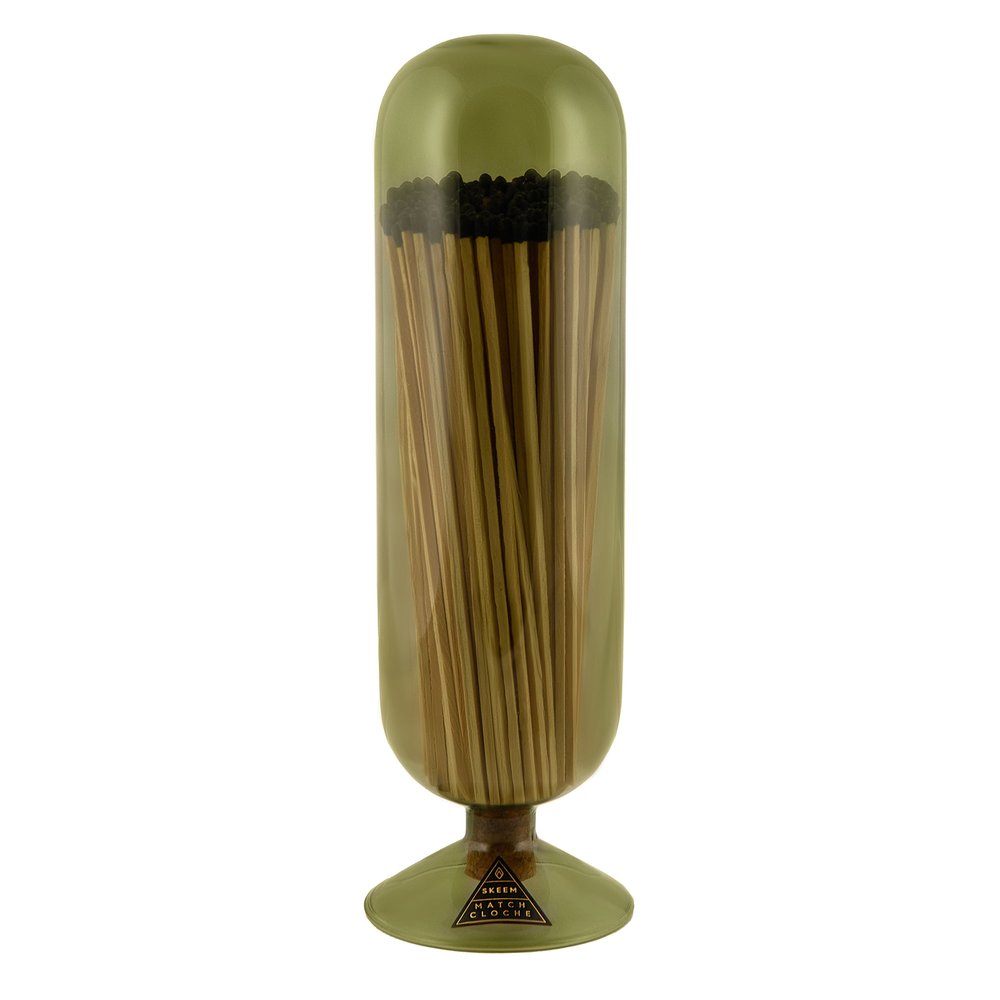 Skeem Olive Fireplace Match Cloche | An olive colored match cloche with long fireplace matches inside. Photo taken against a white background.
