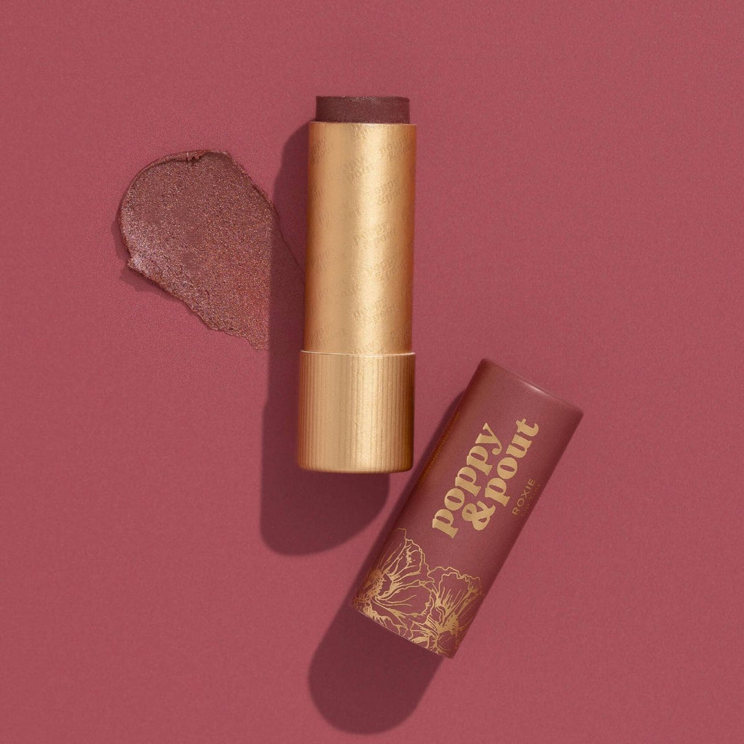 Poppy & Pout | Lip Tint, Roxie | A burgundy red colored lip tined with a gold and burgundy package.