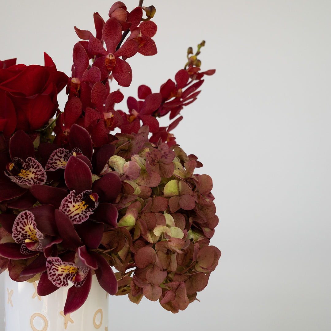 Orchids in red and red hydrangea. Valentines day flower arrangement 