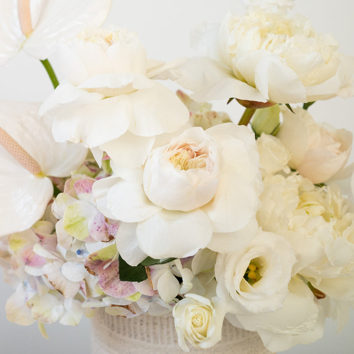 White cloud garden rose in a white floral arrangement.  Florist Rochester NY | Sympathy Flower Delivery 