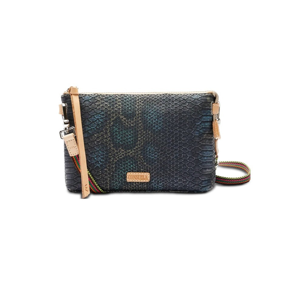 Rattler Midtown Crossbody | Consuela | A dark rattle snake patterned crossbody bag with Diego leather accents and a multi color crossbody strap.