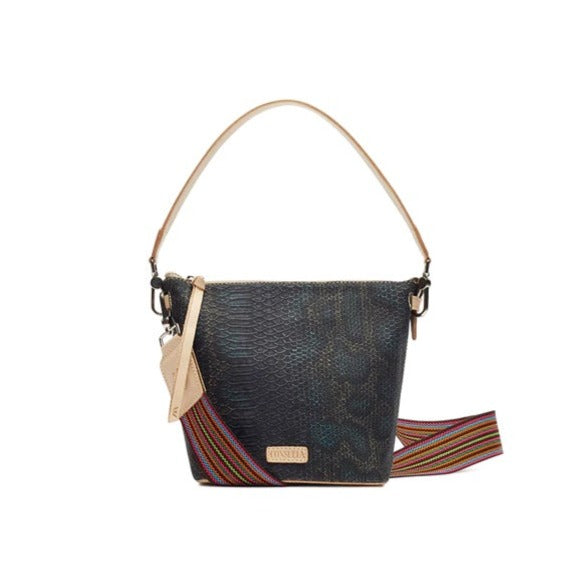 Rattler Wedge | Consuela | A dark rattle snake pattern handbag with Diego leather accents/handle and a multi color crossbody strap.