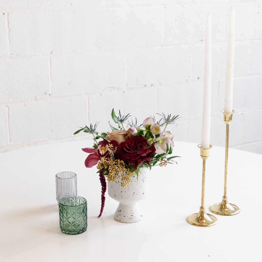 red and blush petite arrangement in the moody and dark color scheme