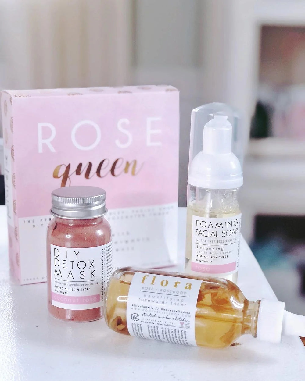 Rose Queen Kit | Honey Belle | Image of the box with contents set on the table in front. DIY Detox Mask, Foaming Facial Soap, and Beautifying rosewater toner.