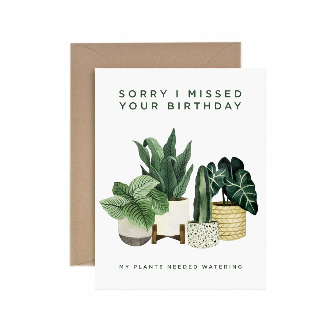 Sorry I Missed Your Birthday| White card with "Sorry I Missed Your Birthday, My Plants Needed Watering". Four plants are water color painted on the front. The inside of this card is blank.