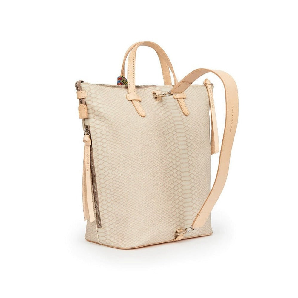 Thunderbird Sling | Consuela | A subtle rattlesnake pattern with Diego leather accents, a side pocket, and a sling strap. Photo shows the back of the bag.