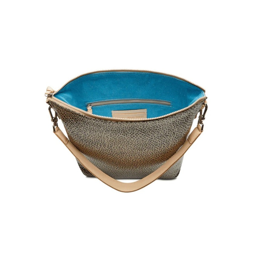 Tommy Hobo | Consuela | Open handbag revealing a sparkly blue interior.