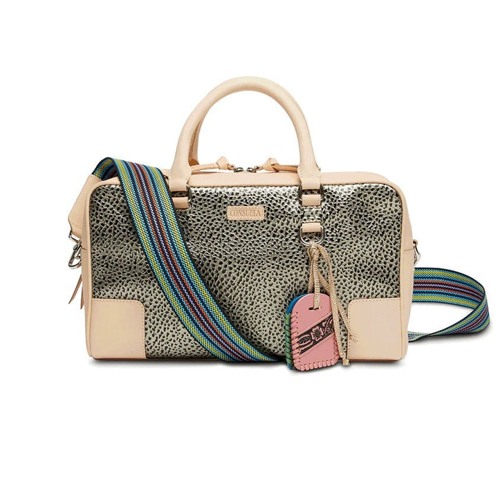 Tommy Satchel | Consuela | A subtle gold and black textured satchel with nude accents and handle with a multi colored strap. Decorative pink and blue tags.