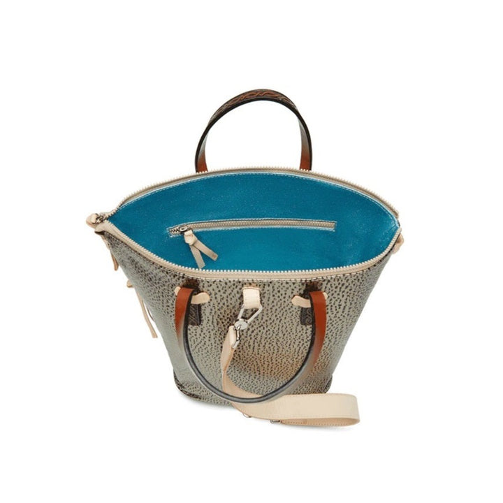 Tommy Sling | Consuela | A gold and black textured bag showing the sparkly blue interior.