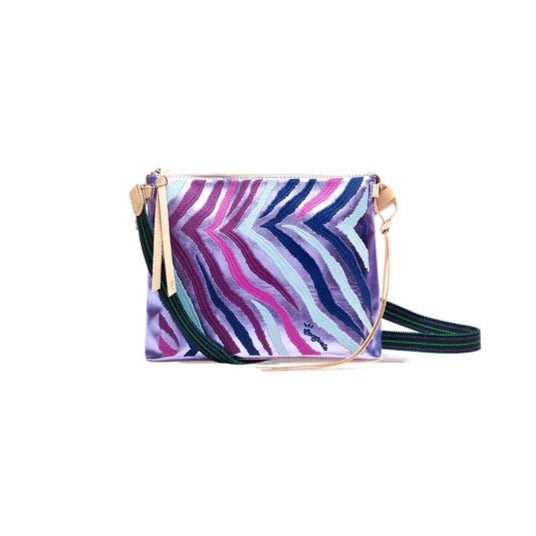 Val Downtown Crossbody | Consuela | A purple zebra print bag with Diego leather accents and a blue/green crossbody strap.
