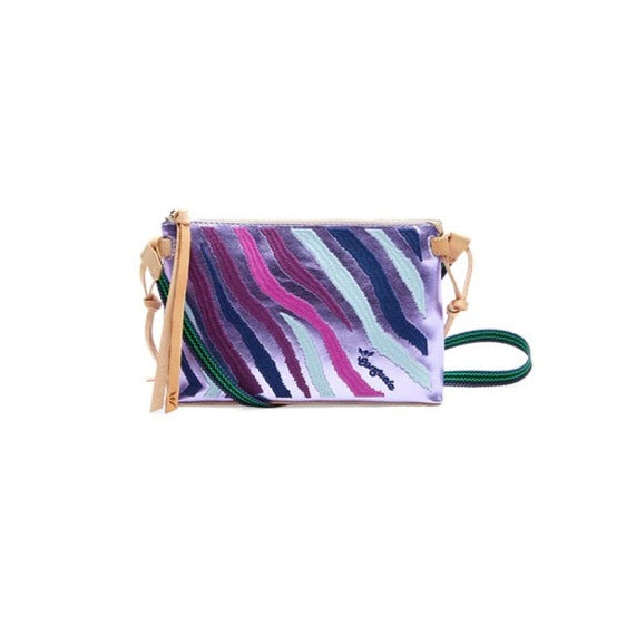 Val Midtown Crossbody | Consuela | A purple and blue zebra patterned bag with Diego leather accents and a green/blue strap.