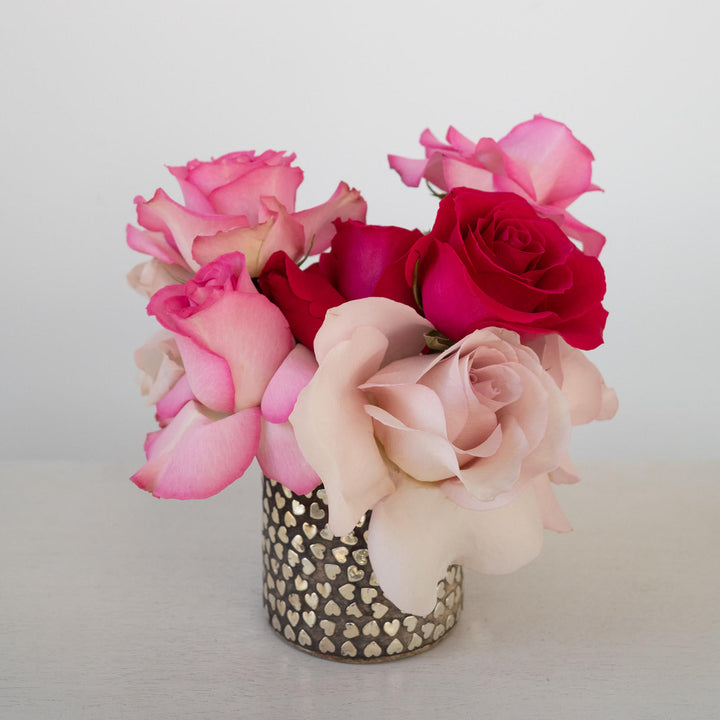 Assorted rose arrangement in a heart themed metal vase. Valentines day flower delivery | Rochester NY Florist 
