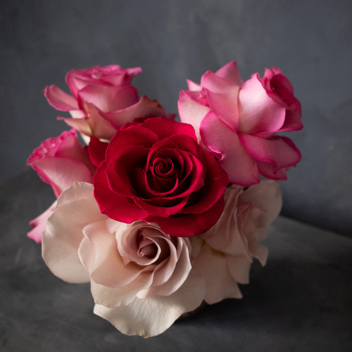 Red rose, blush rose and pink roses in a valentines day themed arrangement. Valentines day flower delivery 