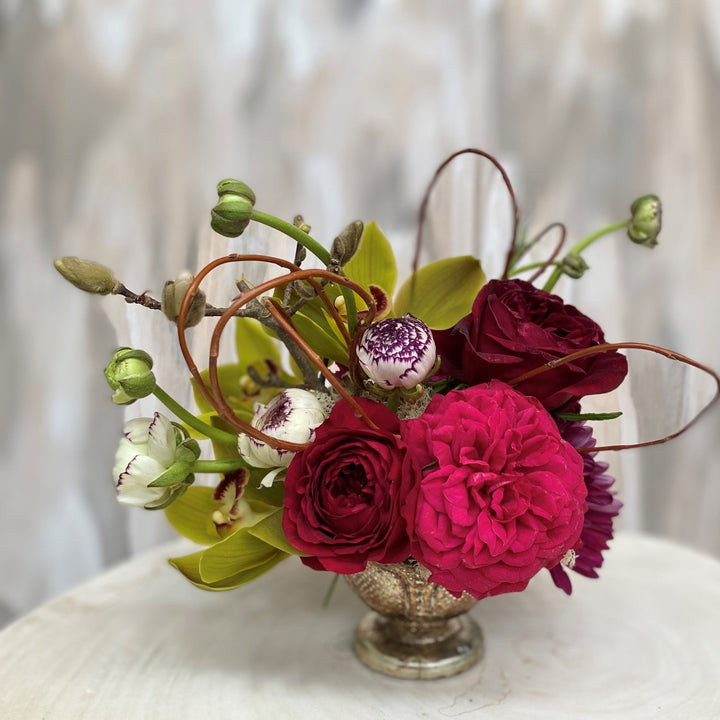 Centerpiece with garden roses and orchids